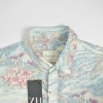 پیراهن هاوایی مردانه آبی آسمانی طرح گل و برگ American Eagle