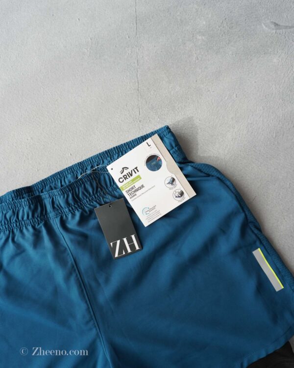 شلوارک دو لایه سبز کبریتی رنگ تیره Crivit